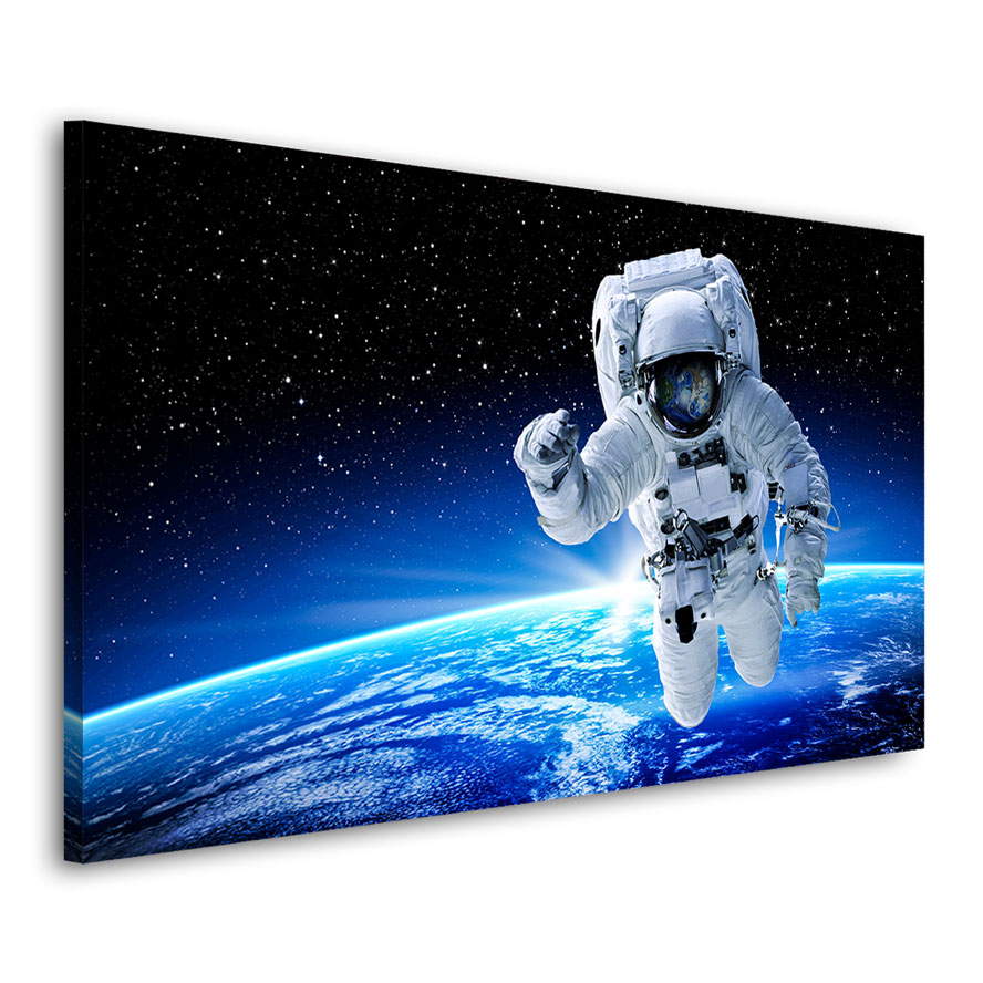 Leinwandbild Astronaut im Weltall
