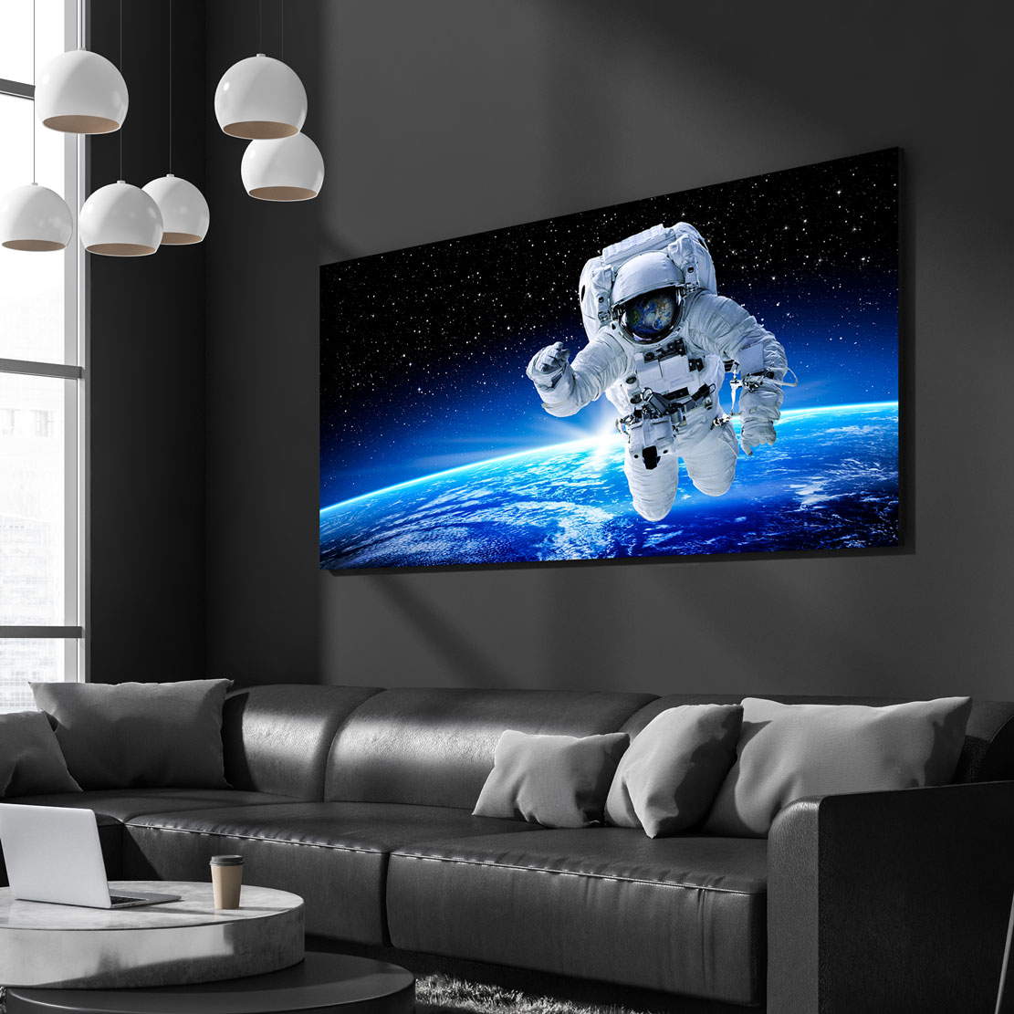 Leinwandbild Astronaut im Weltall