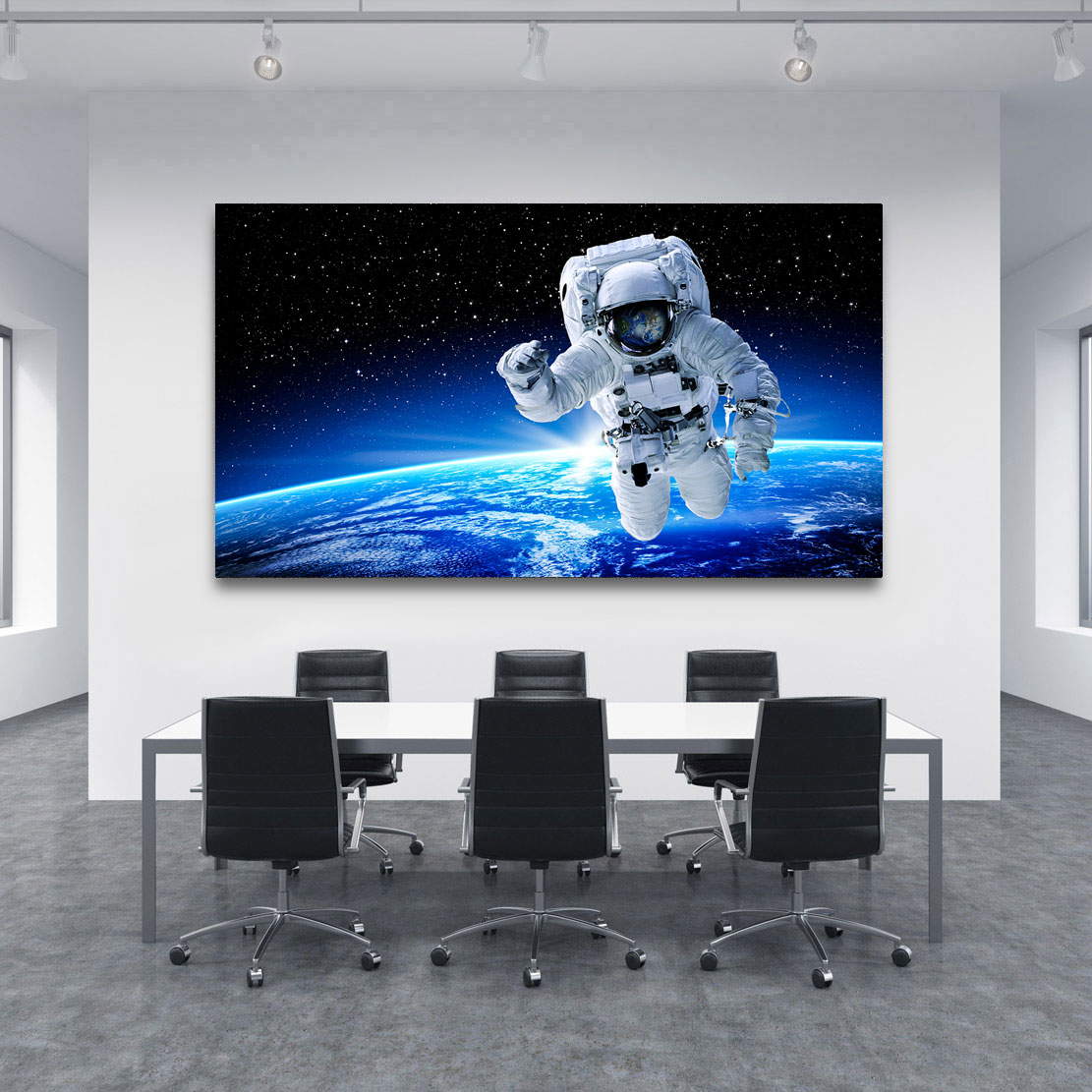 Leinwandbild Astronaut im Weltall